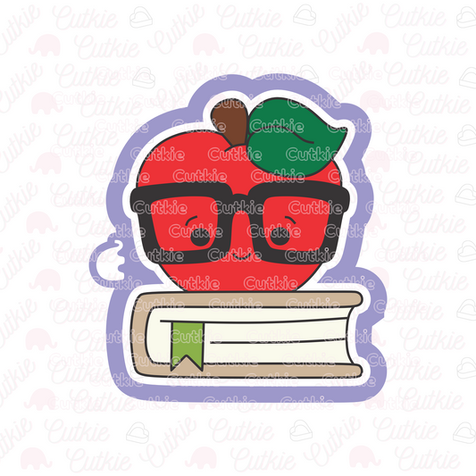Manzana sobre libro